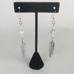 Simple feather earrings made with natural White Howlite beads